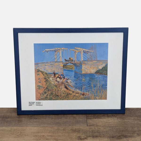Framed print of Van Gogh's Langlois Bridge, featuring vivid yellows and blues.