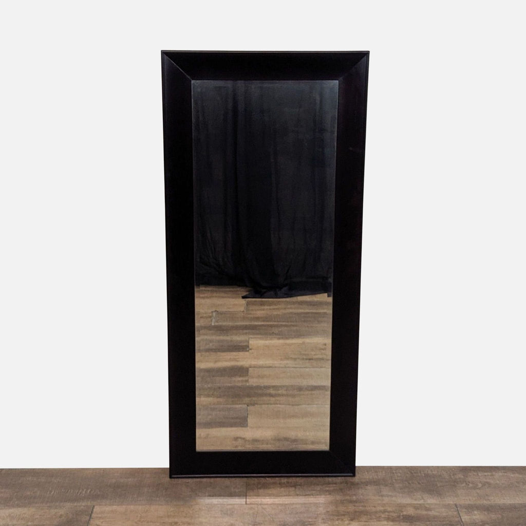 1. Rectangular Reperch mirror with a wide, dark frame, standing on a wooden floor against a light background.