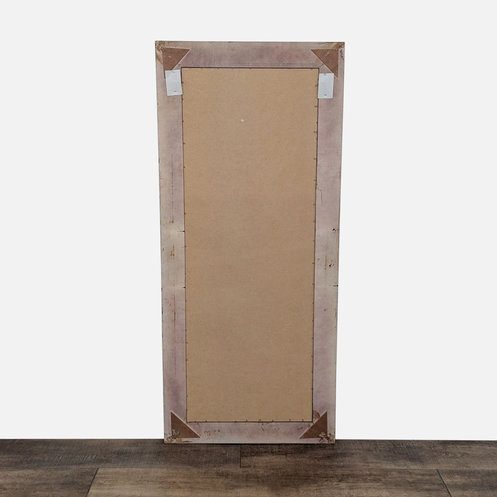 2. Rear view of the Reperch mirror, showing a plain unfinished backing secured with corner supports.