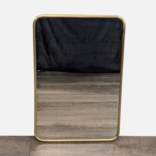 Rejuvenation mirror with an aged brass finish, shown from the front.