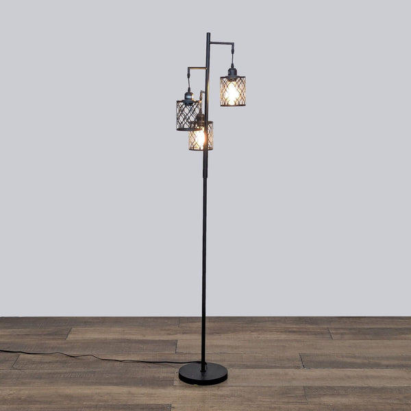 ROTTOGOON floor lamp with three metal cage lights on wooden floor.