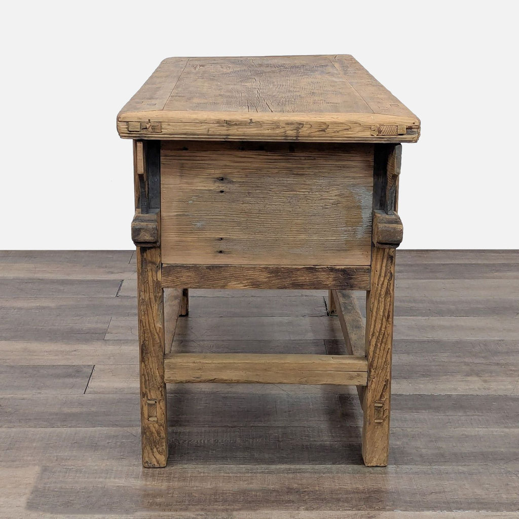 End view of Reperch wooden console table on wooden floor.