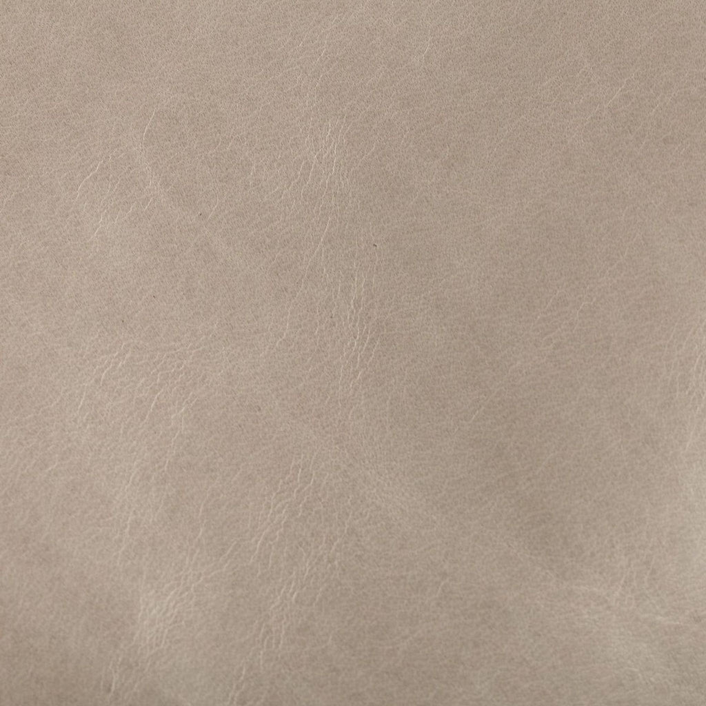 Close-up of pearl leather texture with visible grain.