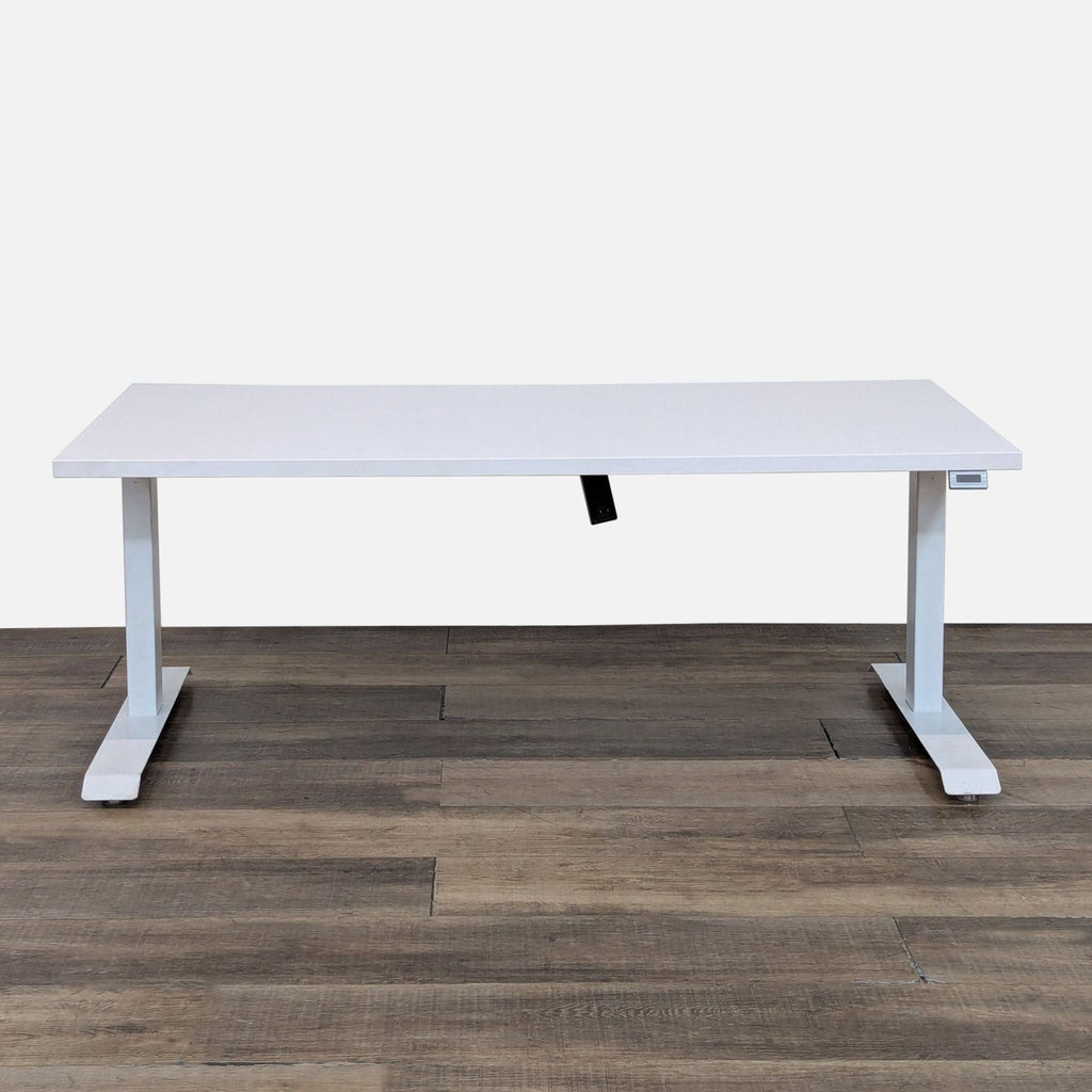 Sleek white desk with adjustable frame for sitting or standing use.