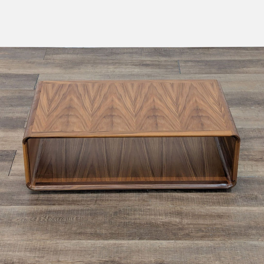 Top view of a walnut veneer coffee table, showcasing elegant wood patterns.