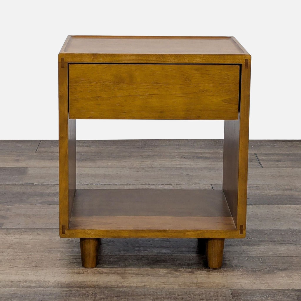 Modern wooden end table by Floyd Home with a drawer and lower shelf.