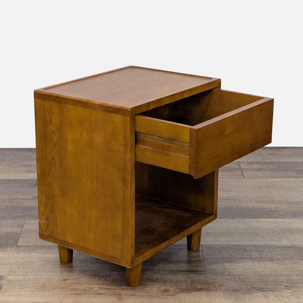 Side view of a Floyd Home end table showing the open drawer and shelving.
