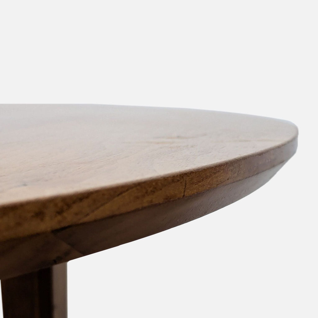 Dining table with a seamless design, extendable to 84 inches.