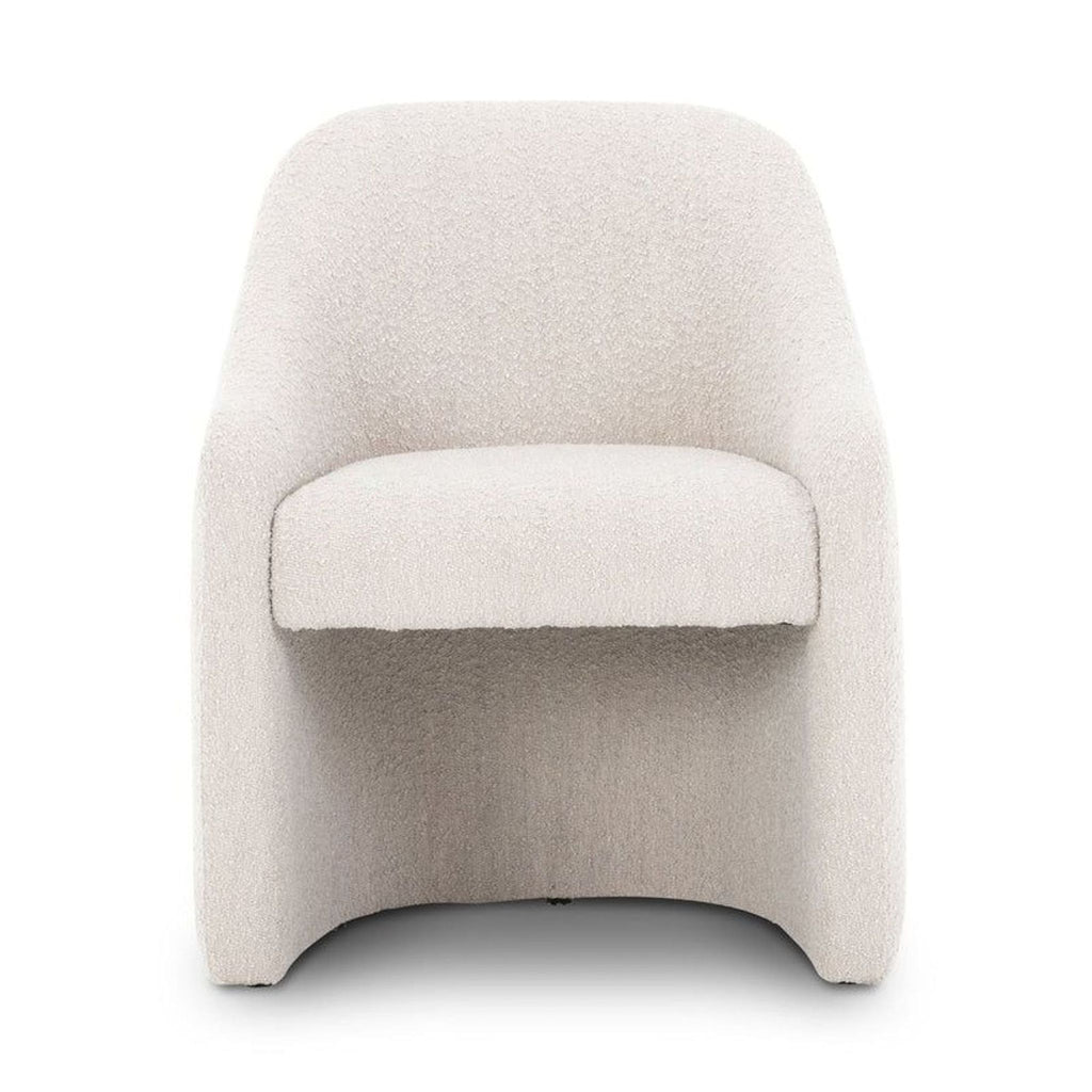 Front view of a chic dining chair with solid pine legs and stain-resistant fabric by Four Hands.