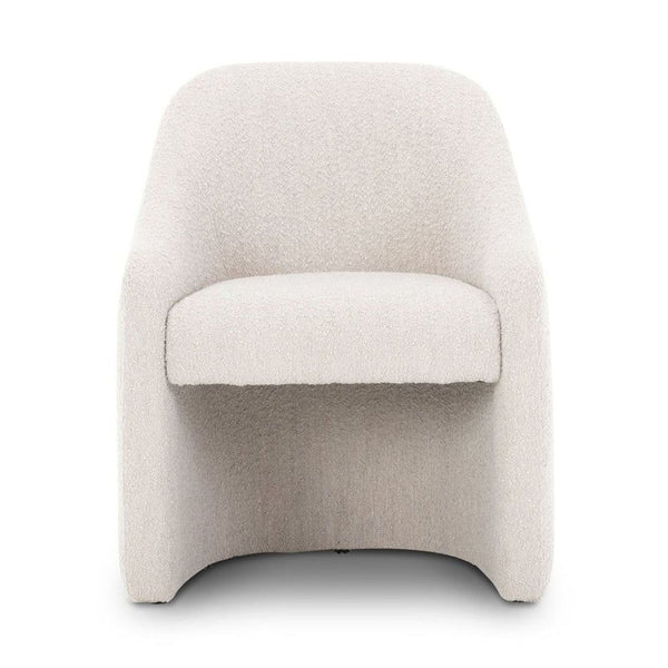 Front view of a chic dining chair with solid pine legs and stain-resistant fabric by Four Hands.