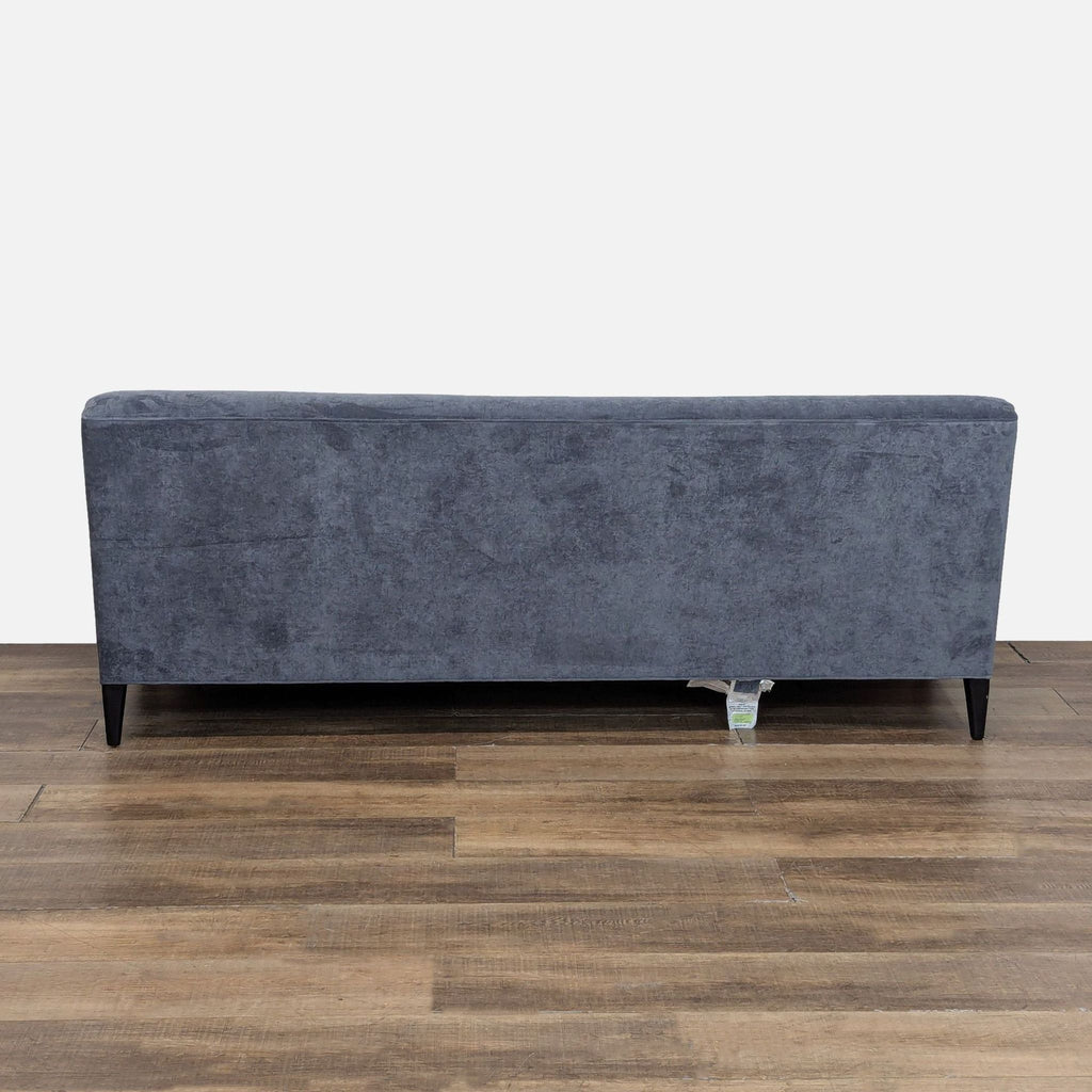Back view of a Mitchell Gold + Bob Williams 3-seat sofa with soft velvet fabric and sleek design.