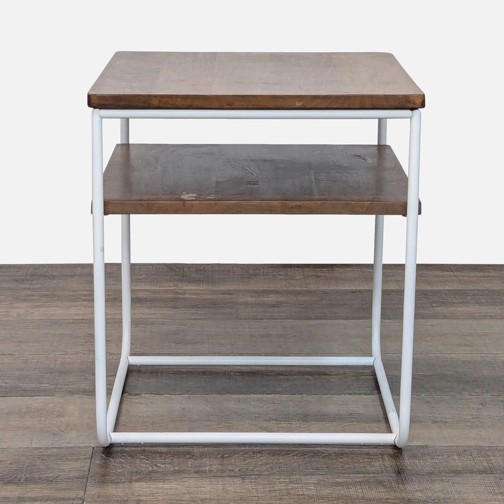 West Elm end table with mango wood surfaces and white metal frame.