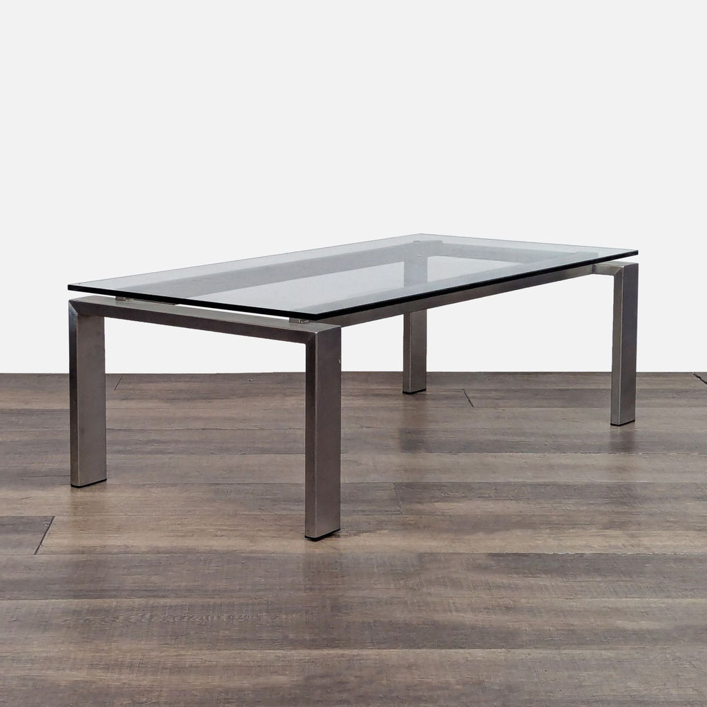 Modern coffee table by Room & Board, featuring a metal frame and glass surface.