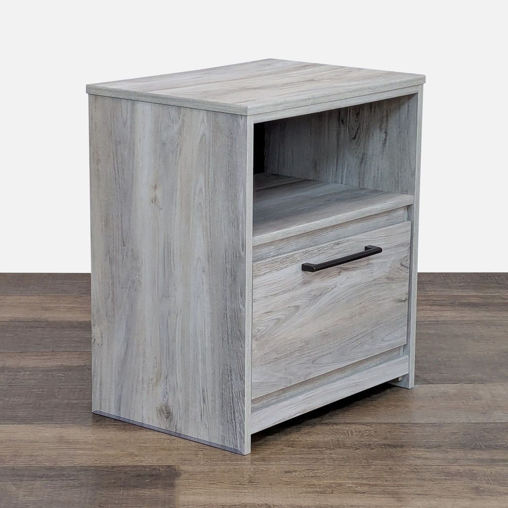 Stylish one-drawer, open-shelf nightstand with USB charger from Ashley Furniture.