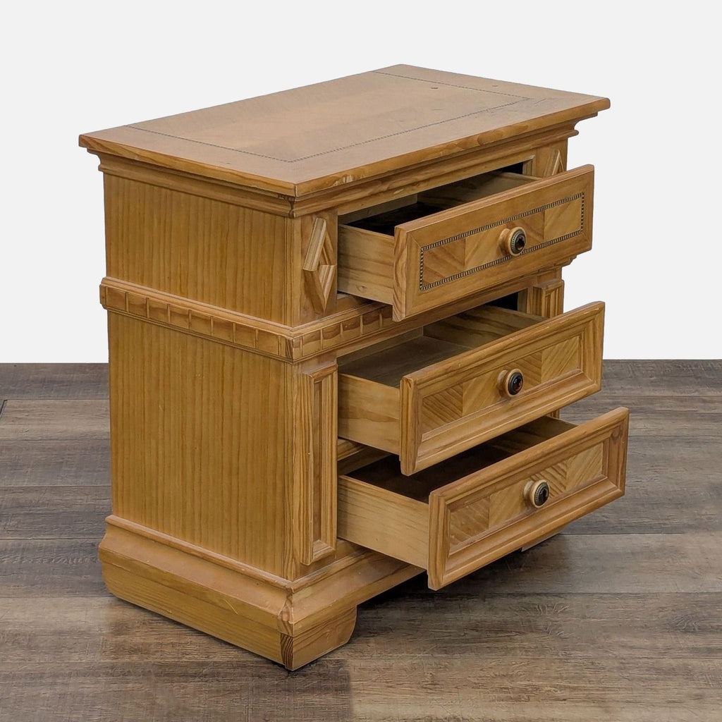 Side view of Reperch end table showing partially open drawers with wood detailing.