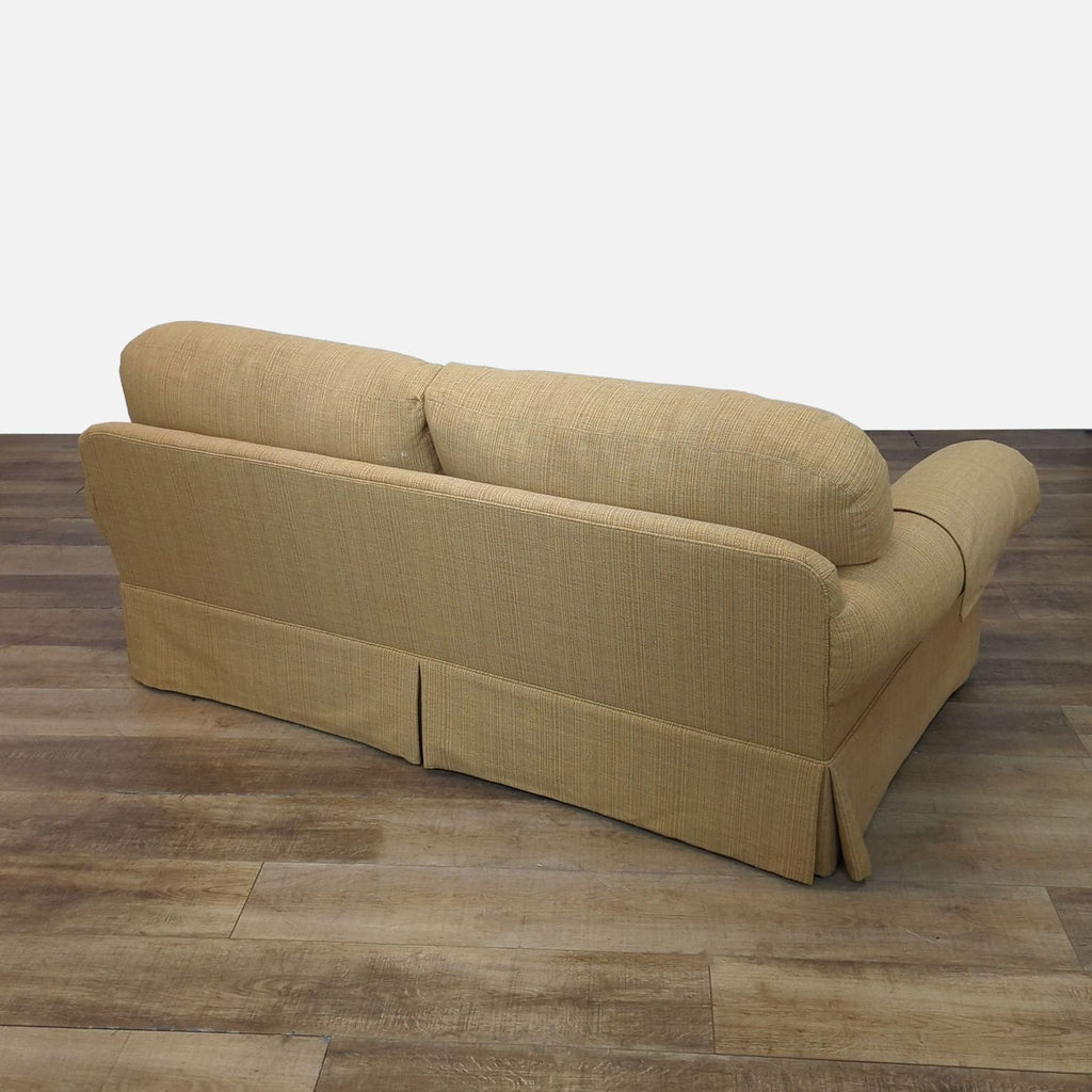 Back view of tan loveseat with cushioned comfort by Lee Industries.