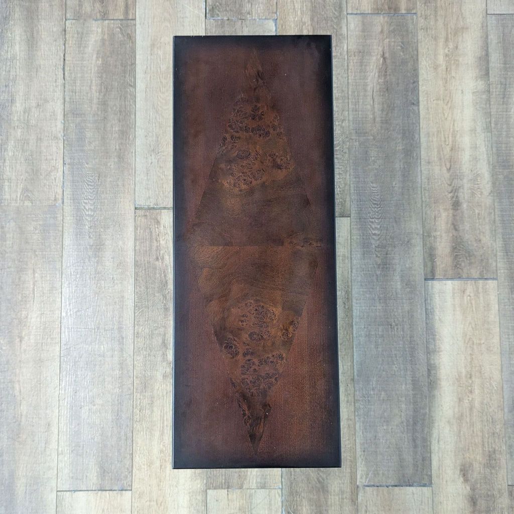 Top view of a solid wood console table with rich wood grain.