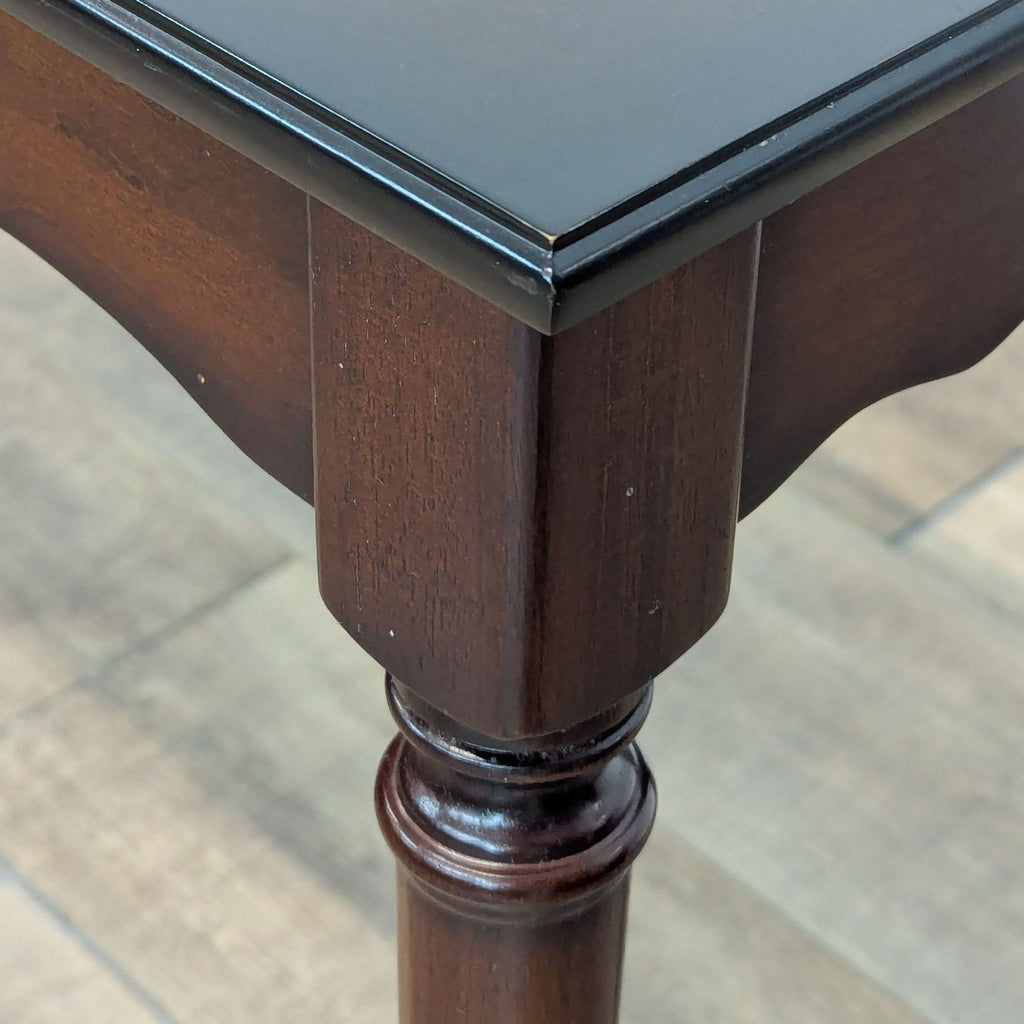 Close-up of the table's corner, showcasing detailed craftsmanship.