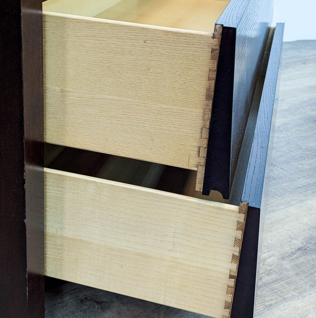 Close-up of dovetail joinery on drawer edges.
