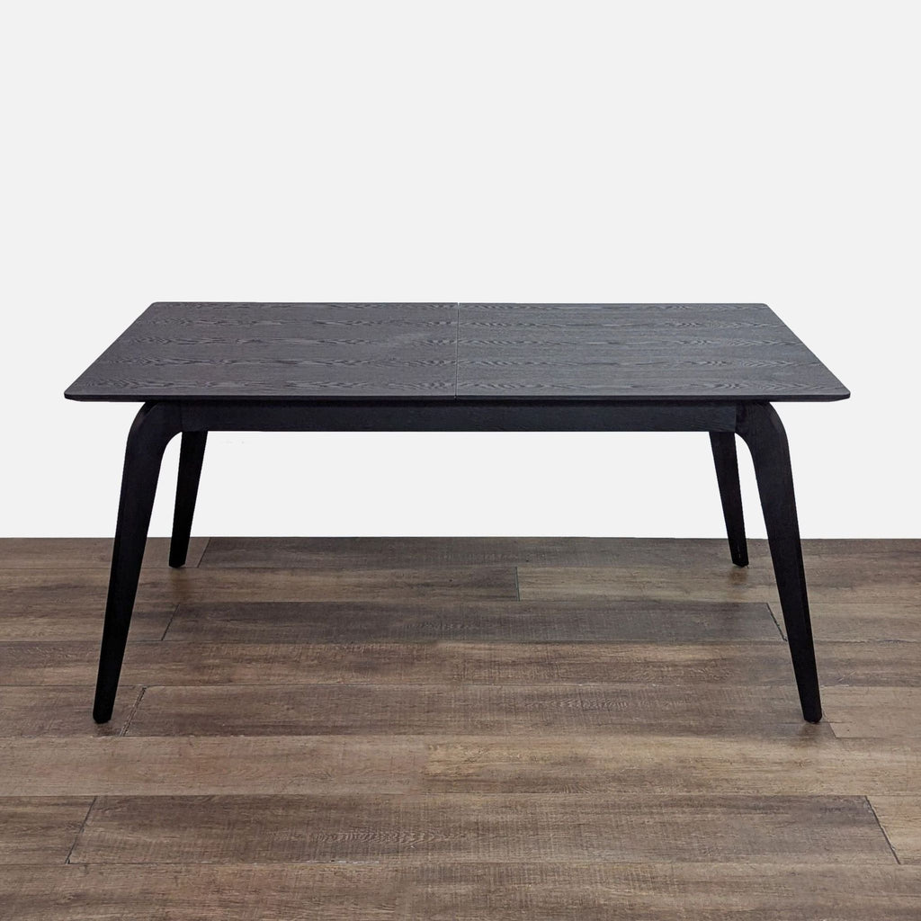 Modern walnut dining table with a butterfly leaf, extends to 83 inches.