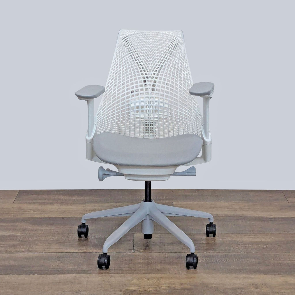 Herman Miller chair with a ventilated elastomer back for air circulation and flexible support.