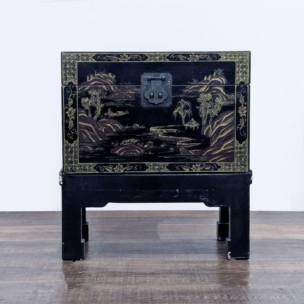 Lacquered trunk on stand with intricate hand-painted landscapes and metal hardware.
