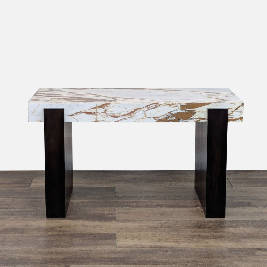 CB2 desk with ivory marble top and black walnut legs, featuring marble-fronted drawers.