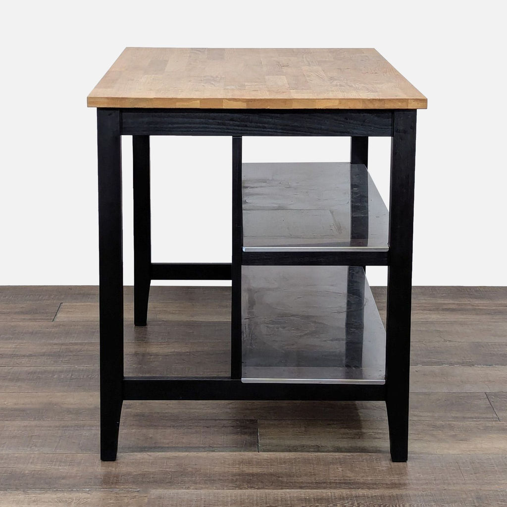 Ikea butcher block table featuring two shelves and a seating section.