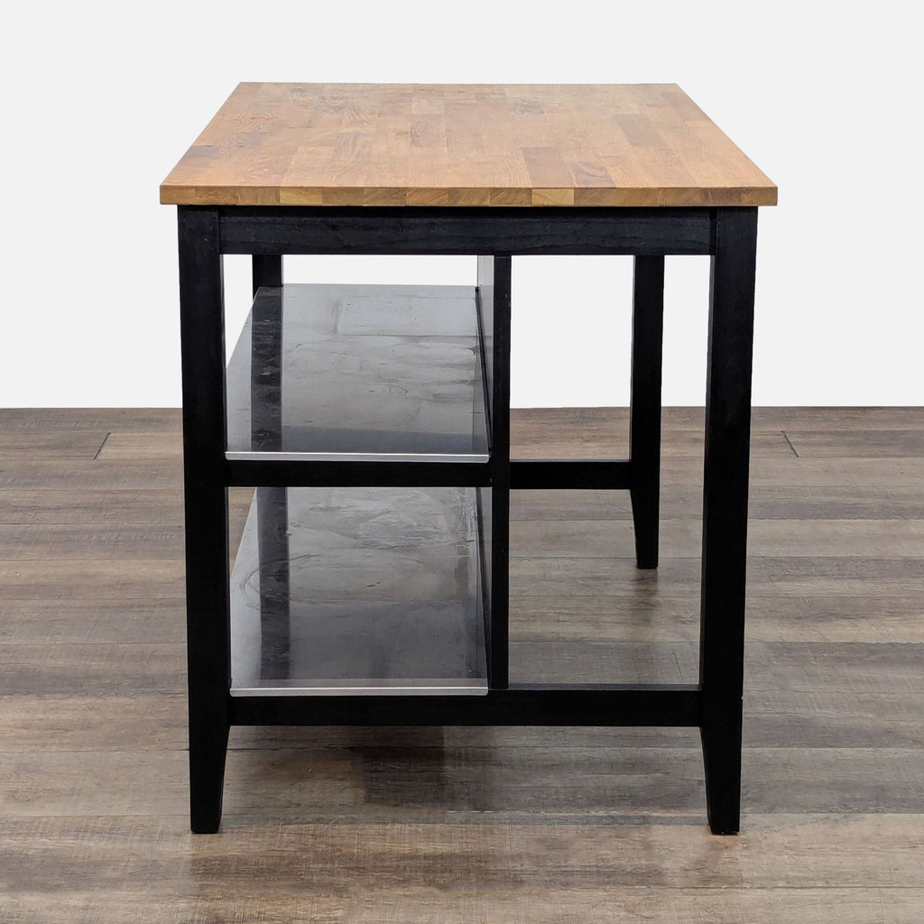 Kitchen island with wooden top, black frame, and dual shelves for storage.