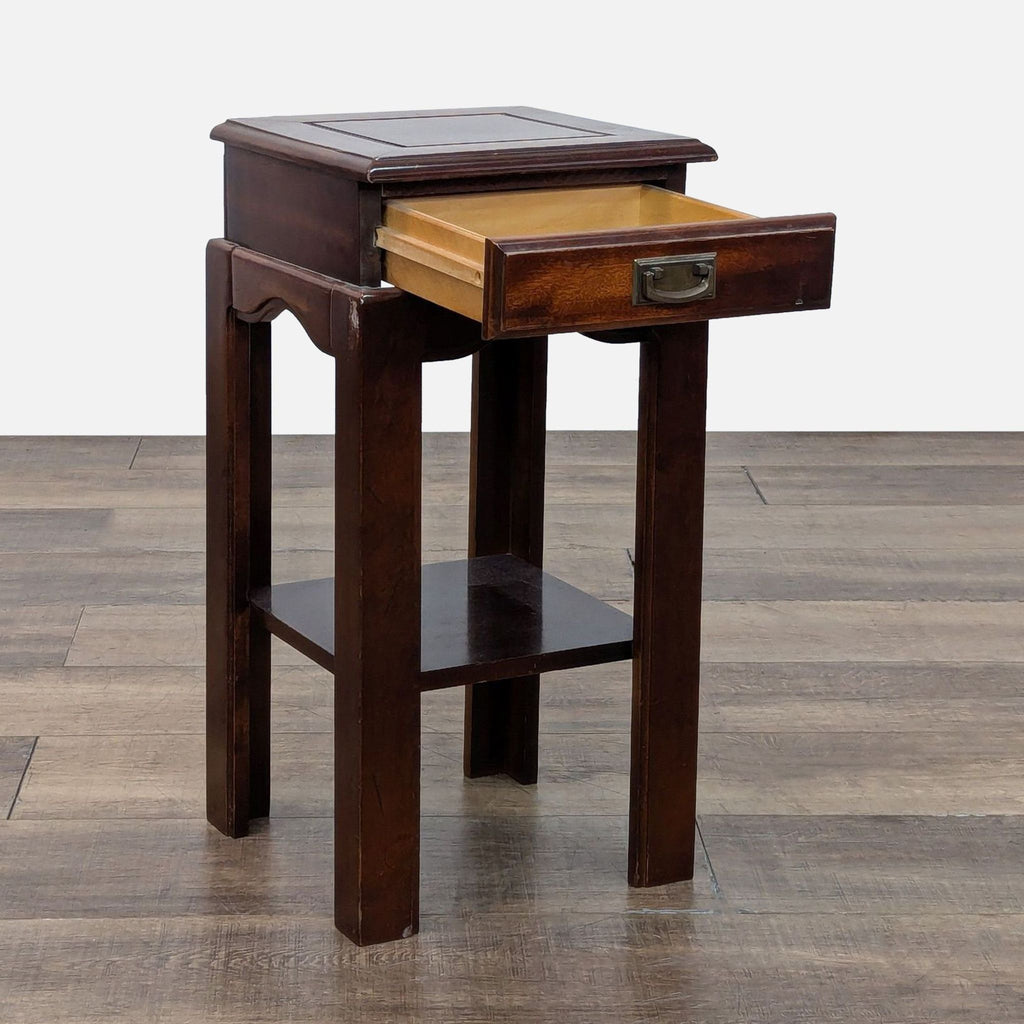 Dark wood console table with open drawer and shelf.