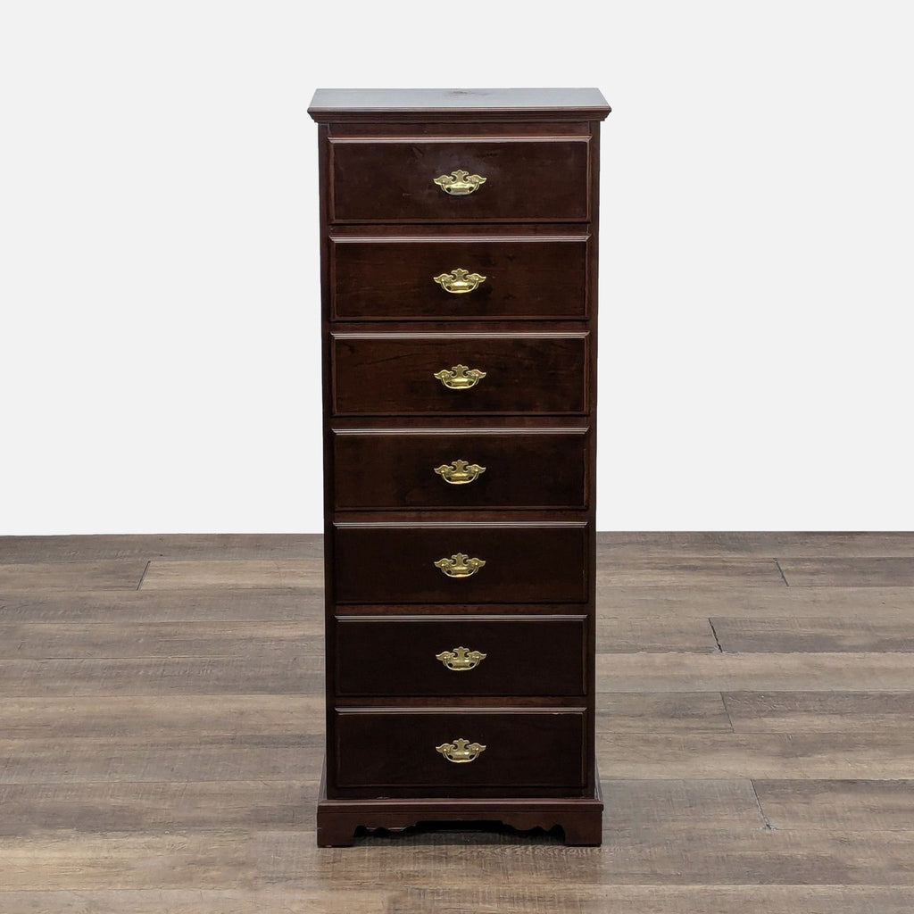 Mahogany dresser with seven drawers and brass pulls.