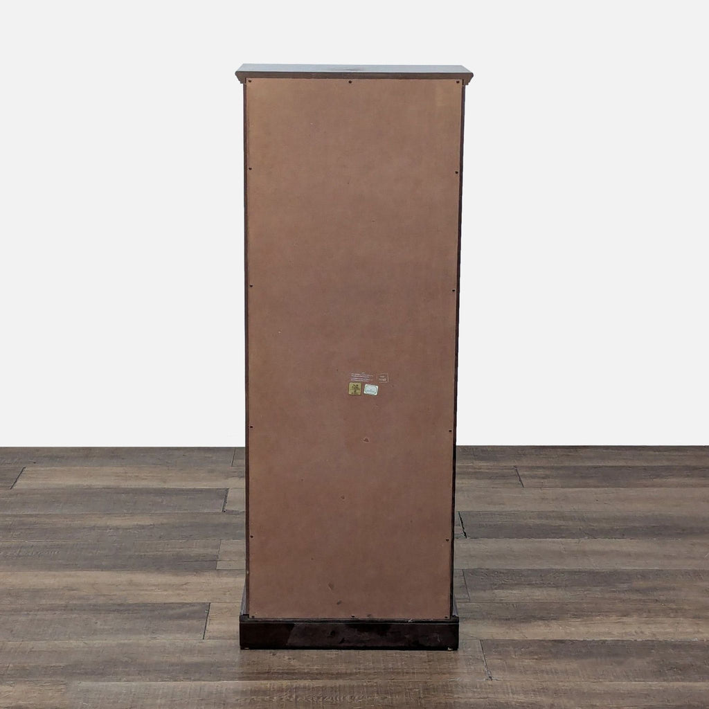 Back view of a tall mahogany dresser from The Bombay Company.