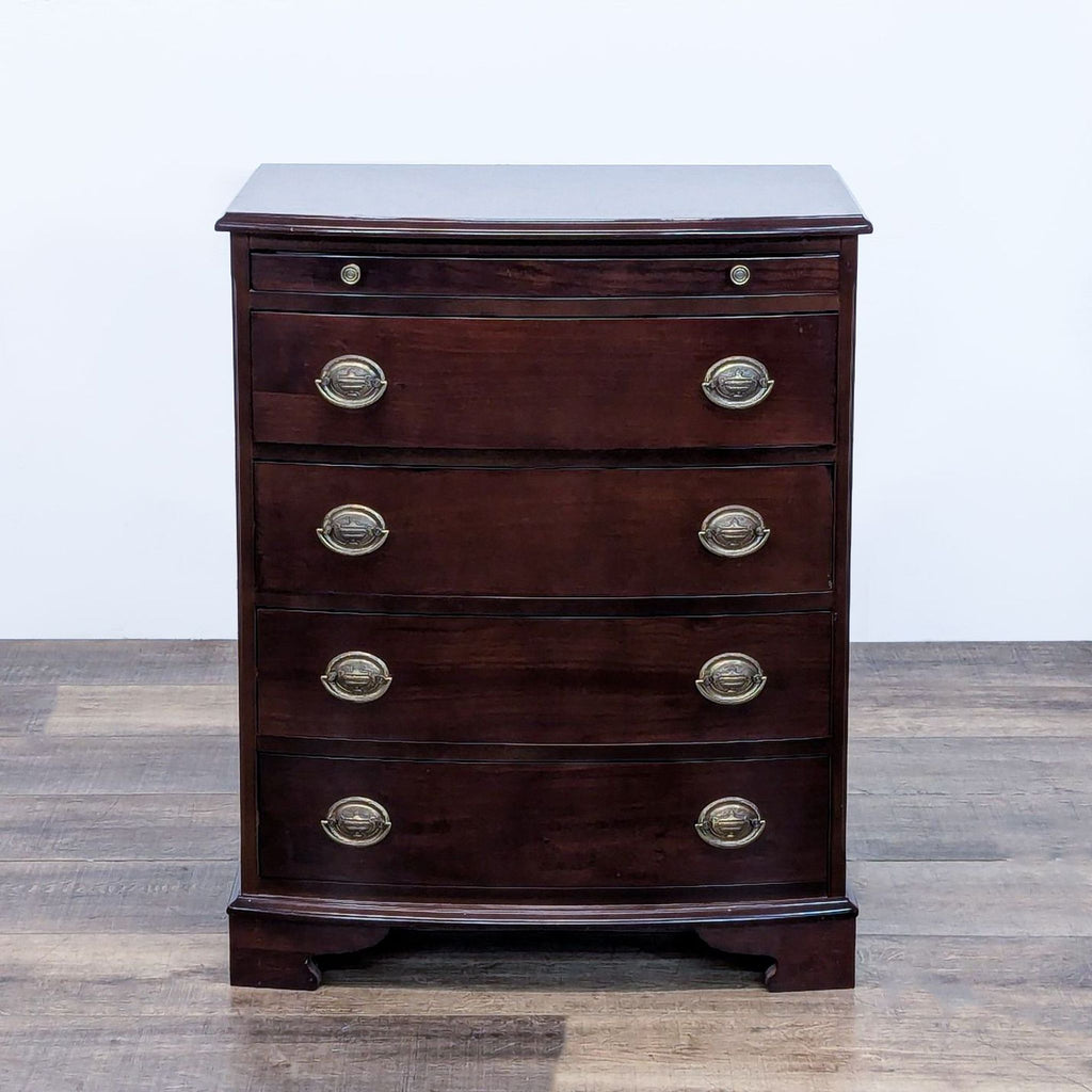 Elegant dresser by The Bombay Company with brass pulls and four drawers.