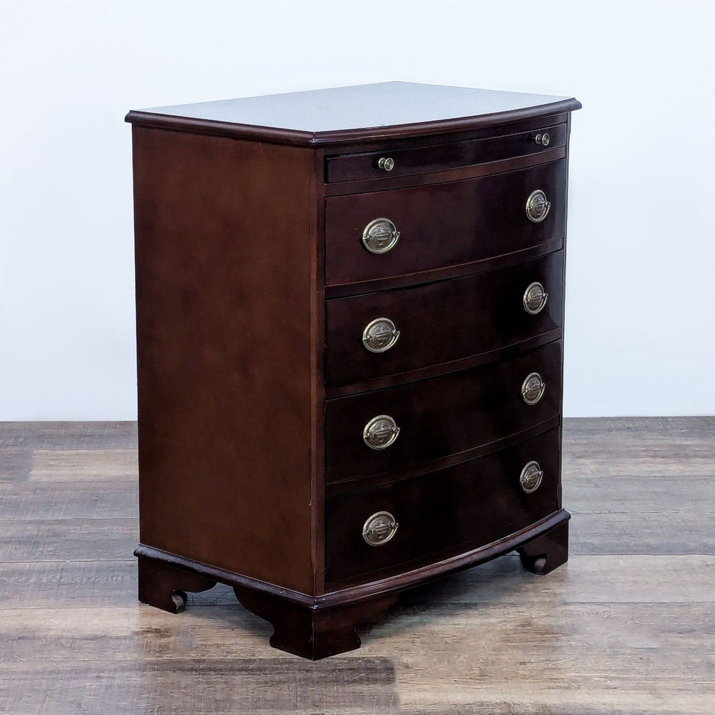 Classic dark wood dresser from The Bombay Company with brass accents.
