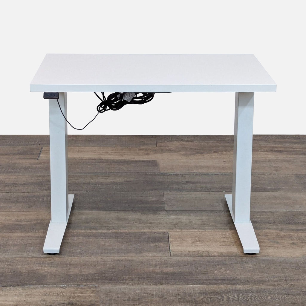 White laminate desk with adjustable height and powder-coated steel base.