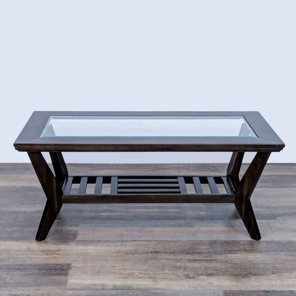 Reperch coffee table with wood frame and splayed legs, featuring a glass top and slatted shelf.