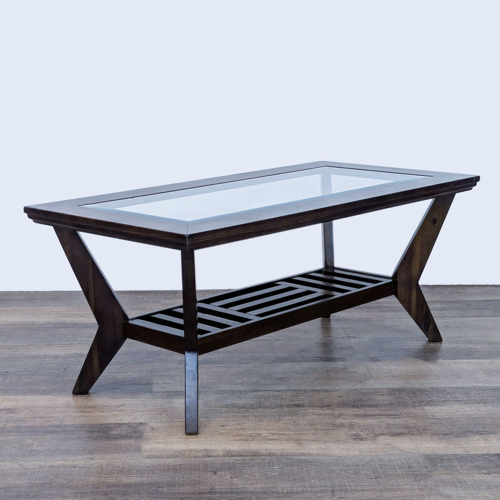 Elegant coffee table by Reperch, showcasing a dark wood frame, splayed legs, and glass surface.