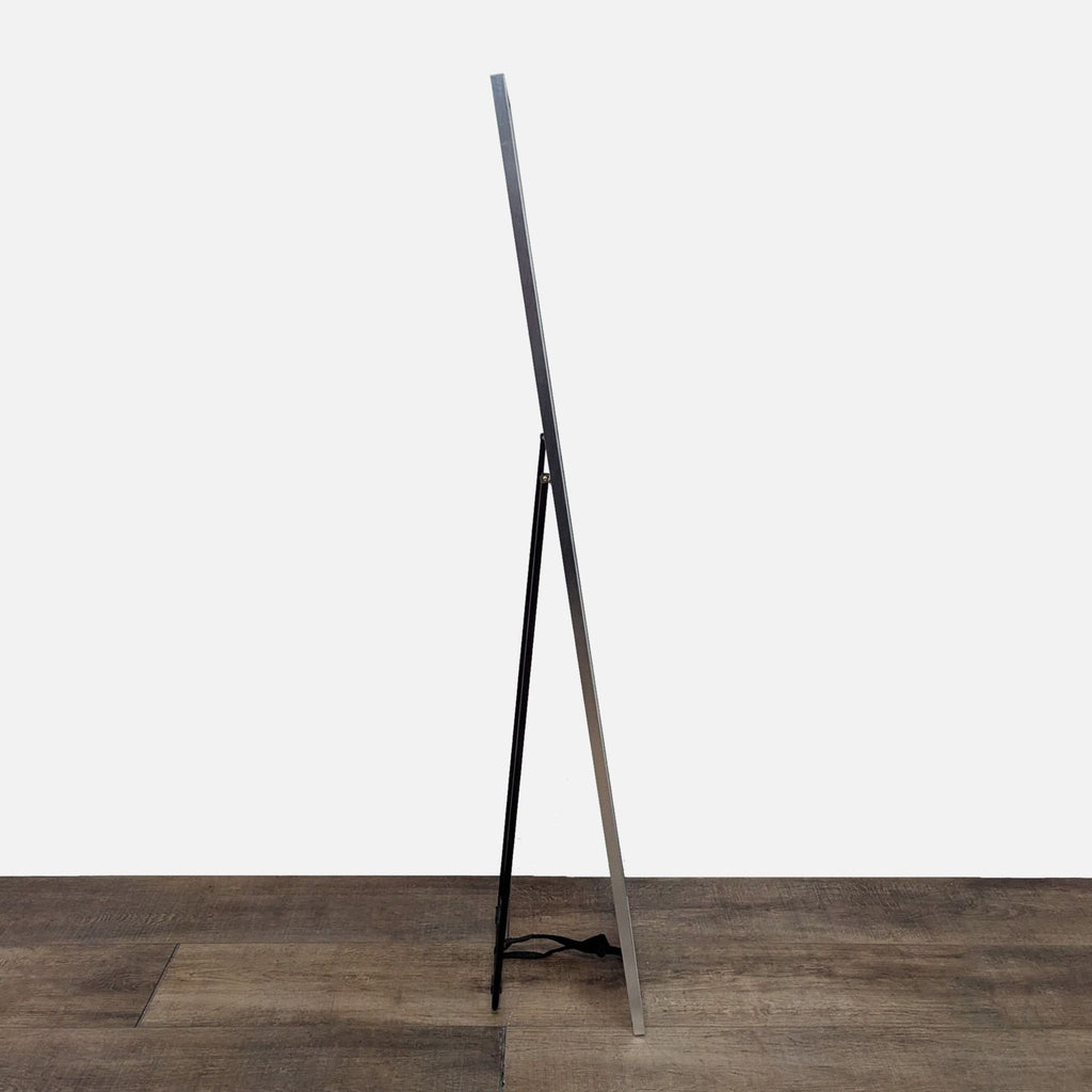Side view of Reperch standing mirror with a slim profile.