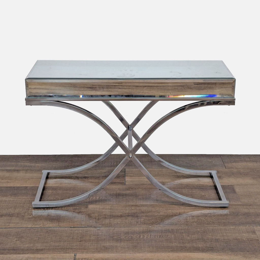 Curved X-frame side table with a beveled mirror top.  