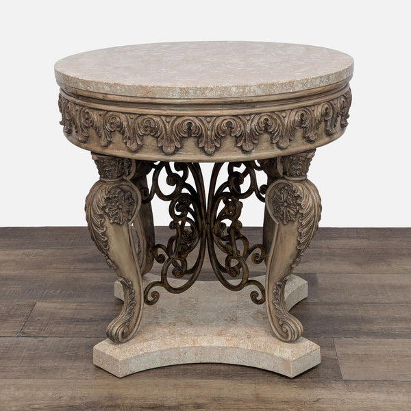 Reperch end table with ornate carvings and scrollwork details on legs and base.  
