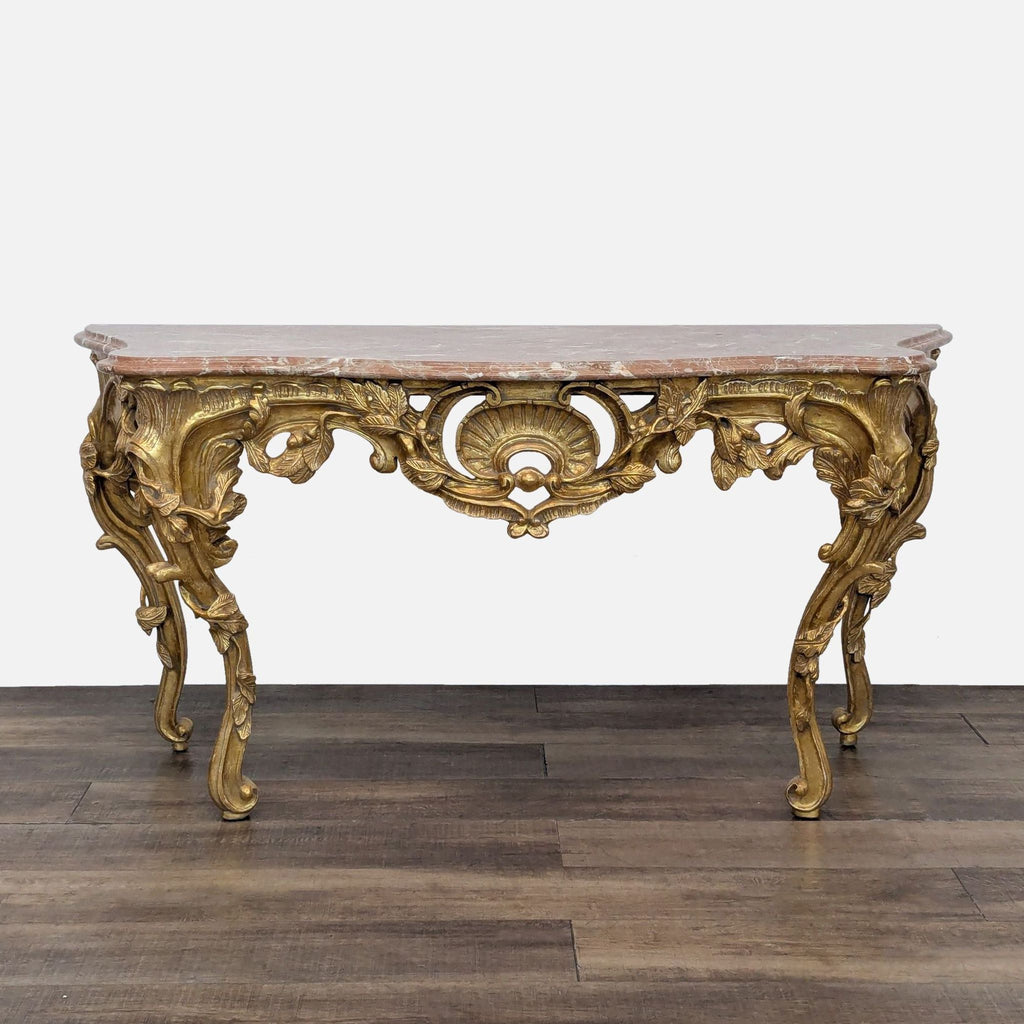 Hand-crafted Rococo gilded console table with a marble top.