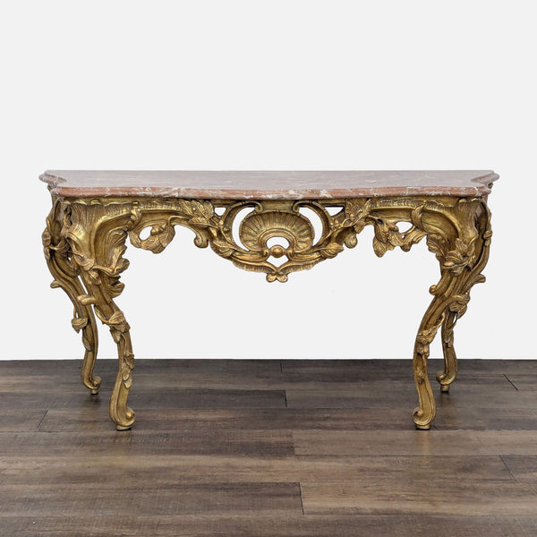 Hand-crafted Rococo gilded console table with a marble top.