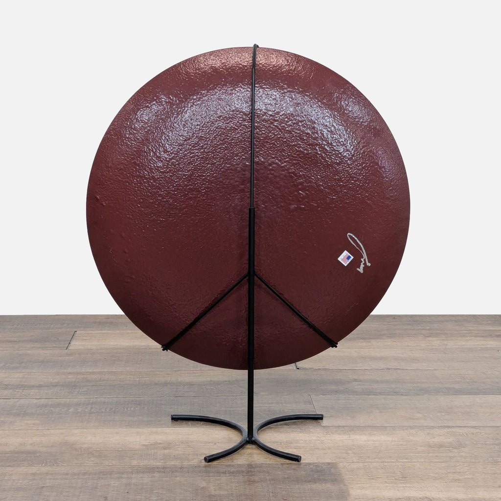 Back view of the decorative plate on a metal stand.