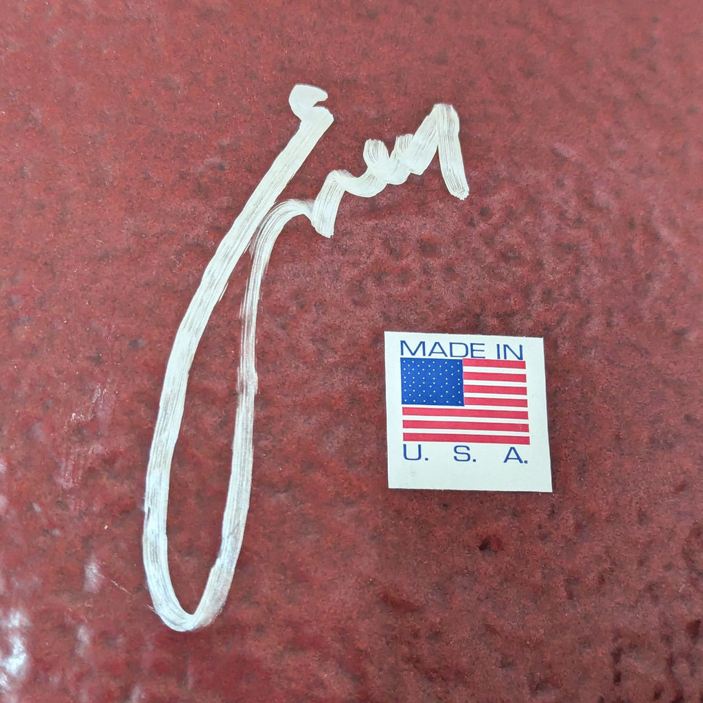 Close-up of the plate's signature and "Made in USA" label.