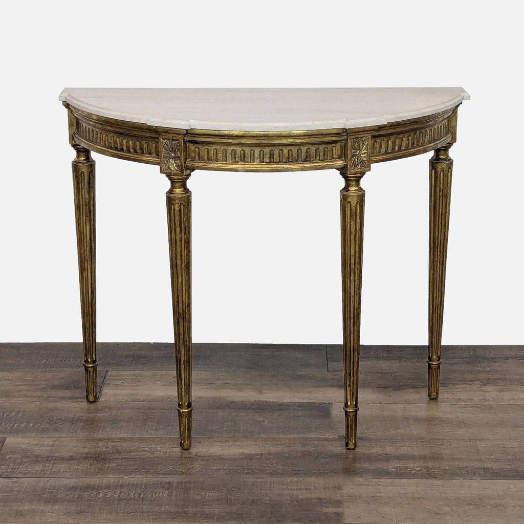 Fluted and gilded legs with floral carvings on a semicircular console table by Reperch.