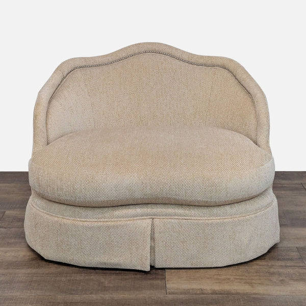 Lounge chair with scalloped edges, nailhead trim, and swivel base by Century Furniture.