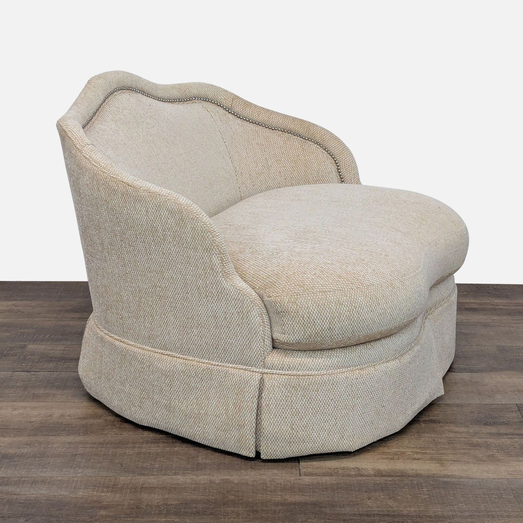 Elegant lounge chair with nailhead trim and a 360-degree swivel base by Century Furniture.