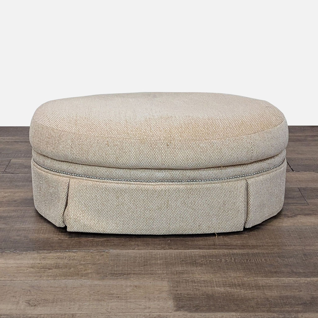 Beige woven ottoman by Century Furniture, perfect for adding comfort and style to any room.