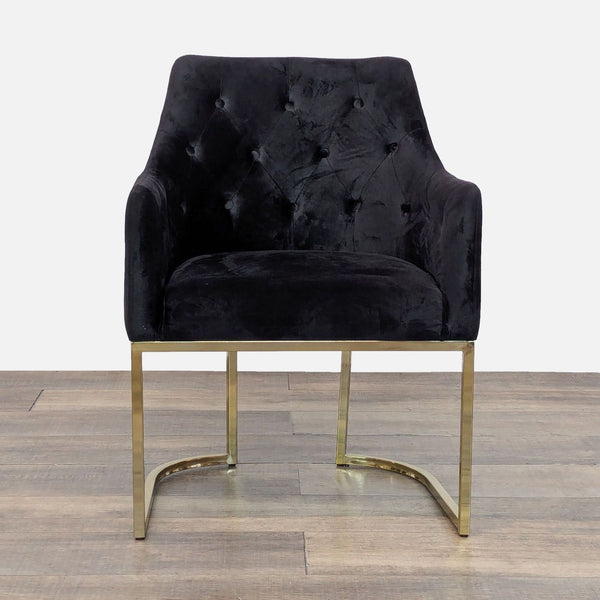 Velvet lounge chair with tufted upholstery and gold metal frame, front view.  