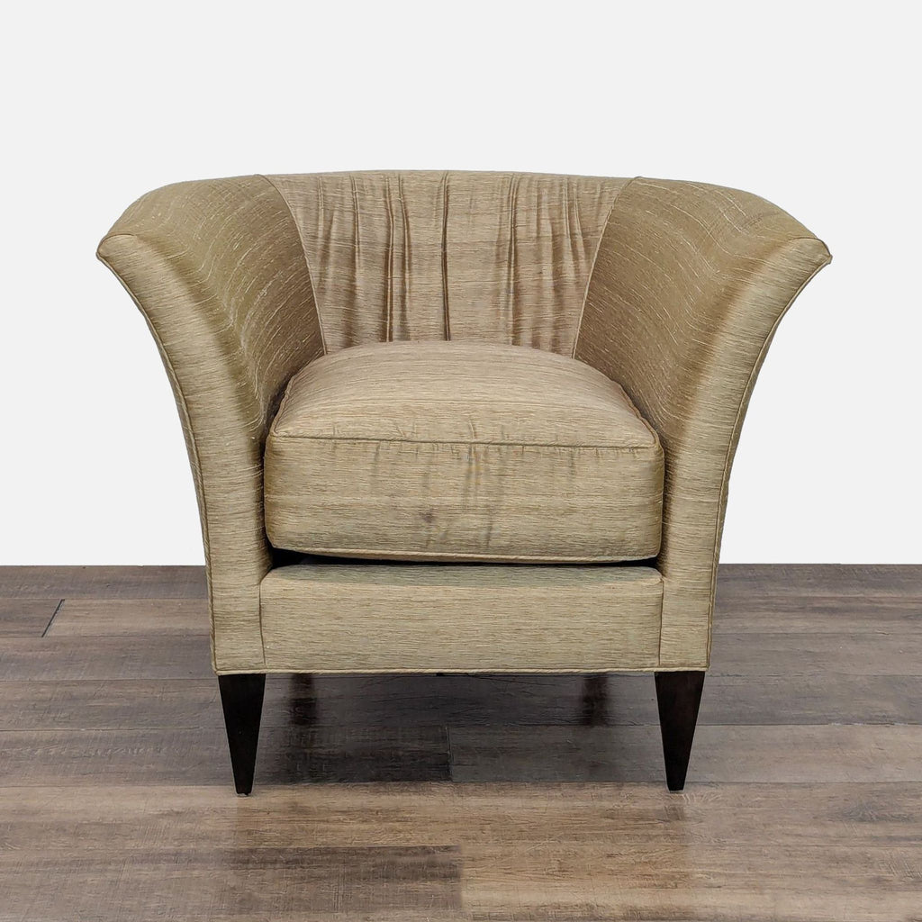 Front view of a Reperch lounge chair with satin-like upholstery and dark wood legs.  